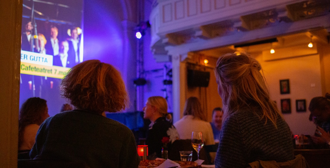 Picture of two ladies watching the screen.